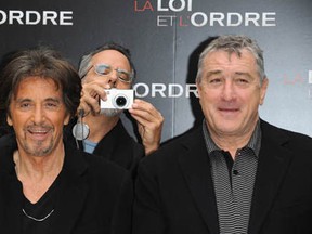 Director Ron Avnet takes a pictures as actors Al Pacino (L) and Robert De Niro (R) pose during a photocall for Avnet's film Righteous Killon September 15, 2008 in Paris, France.  (Pascal Le Segretain/Getty Images)