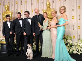 (L-R)  Producer Thomas Langmann, actor Jean Dujardin, director Michel Hazanavicius, actors James Cromwell, Berenice Bejo, Uggie the dog, Penelope Ann Miller, and Missi Pyle  pose in the press room after winning the Best Picture Award at the 84th Annual Academy Awards held at the Hollywood & Highland Center on February 26, 2012 in Hollywood, California.  (Jason Merritt/Getty Images)
