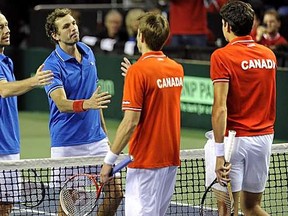 VANCOUVER, BC: FEBRUARY 12, 2012 - - Canada's Daniel Nestor and Milos Raonic loose to France's Michael Llodra and Julien Benneteau during Davis Cup Men's Doubles tennis action at UBC Doug Mitchell Thunderbird Arena Â in Vancouver  on Saturday,February12, 2012.

(Les Bazso,PostMedia)

(see PNG story)  00059258A   00059249A