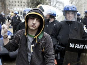 WASHINGTON - FEBRUARY 4:  A member of Occupy DC rolls his eyes as US Park Police close a section of McPherson Square February 4, 2012 in Washington, DC.  US Park police raided the Occupy DC camp at McPherson Square before dawn to enforce no camping rules.  (Photo by Brendan Smialowski/Getty Images)