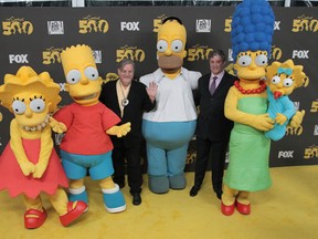 Whoa! Talk about larger than life! Matt Groening, (L) creator/executive producer, and executive producer Al Jean attend FOX's The Simpsons500th Episode Celebration at the Hollywood Roosevelt Hotel on February 13, 2012 in Hollywood, California.  (Frederick M. Brown/Getty Images)