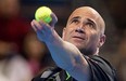 MONTREAL, QUE.: MARCH 2, 2012--Andre Agassi serves the ball to Michael Chang (not seen) during the Masters Rendez-Vouz tennis event in Montreal Friday March 2, 2012.  (Allen McInnis / THE GAZETTE)