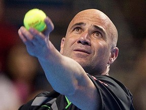 MONTREAL, QUE.: MARCH 2, 2012--Andre Agassi serves the ball to Michael Chang (not seen) during the Masters Rendez-Vouz tennis event in Montreal Friday March 2, 2012.  (Allen McInnis / THE GAZETTE)