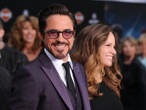 Actor Robert Downey Jr. and his wife Susan Levin Downey arrive at the premiere of The Avengers at the El Capitan Theatre on April 11, 2012 in Hollywood, California.  (Photo by Jason Merritt/Getty Images)