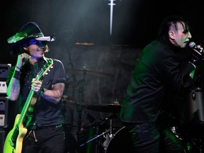 Actor Johnny Depp performs with Marilyn Manson during the 2012 Revolver Golden Gods Award Show at Club Nokia on April 11, 2012 in Los Angeles, California.  (Photo by Frazer Harrison/Getty Images)