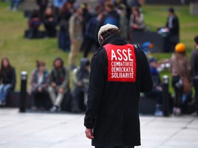 MONTREAL, QUE: APRIL 25, 2012  - A   member of security for the student group CLASSE walks alone at Emilie Gamelin park before the start of a student protest againt tuition hikes In Montreal on April 25, 2012.   ( Dario Ayala/ THE GAZETTE)