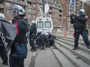 MONTREAL, QUE: FRIDAY APRIL 20, 2012. -- A student is arrested by police as he and others tried to enter the Palais de Congres in Montreal, Quebec in an attempt to shut down to disrupt the the Salon du Plan Nord where Premier Jean Charest will speak about his economic development plans for the province  Friday, April 20, 2012. (Peter McCabe / THE GAZETTE )