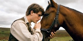 Jeremy Irvine and the horse we're supposed to care about in War Horse.