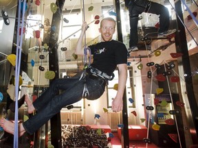 Google employee Eric Dingle hangs out on the rock climbing wall at the Google offices in Montreal, Monday, March 19, 2012. [THE GAZETTE/Graham Hughes]
