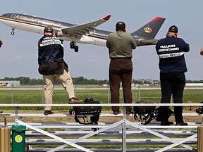 MONTREAL, QUE.: MAY 24, 2012 -- Members of Airport Watch stand on new bleachers to photograph a Royal Jordanian Airlines jet take off from Trudeau Airport at  Jacques-de-Lesseps Park in Dorval, west of Montreal, Friday May 24, 2012.  The park, the first of its kind in Canada, is set up for plane spotters to watch aircraft take off and land.  (John Mahoney/THE GAZETTE)