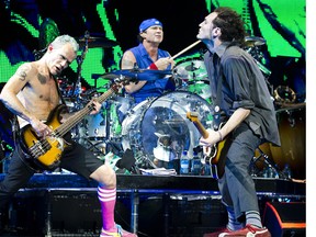 (Left to right) Bassist Flea, drummer Chad Smith,  and guitarist Josh Klinghoffer at the Bell Centre by Dario Ayala/THE GAZETTE.