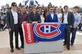 (From L) British actor Sam Riley, US actor Viggo Mortensen, Brazilian director Walter Salles, US actress Kirsten Stewart, British actor Tom Sturridge, US actress Kirsten Dunst, US actor Garrett Hedlund and British actor Danny Morgan pose with the flag of ice hockey team "Montreal's Canadians" during the photocall of "On the Road" presented in competition at the 65th Cannes film festival on May 23, 2012 in Cannes.   ALBERTO PIZZOLI/AFP/GettyImages
