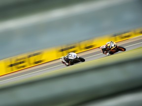 TOPSHOTS Britain's Scott Redding (2nd R) follows Spanish rider Marc Marquez (R) during the Moto2 race of the British Grand Prix at the Silverstone racetrack near Northampton on June 17, 2012.  ADRIAN DENNIS/AFP/GettyImages