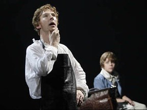 Benedict Cumberbatch, left, as Victor Frankenstein, shares a moment of contemplation with his younger brother William (Haydon Downing). Photo by Catherine Ashmore, from the web site of the National Theatre.
