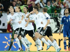 German forward Miroslav Klose (C) celebrates after scoring during the Euro 2012 football championships quarter-final match Germany vs Greece on June 22, 2012 at the Gdansk Arena.
Photograph by: Aris Messinisaris, AFP/Getty Images
