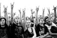 Heavy metal fans flash the genre's popular two-fingered "Sign of the horns" salute at Heavy MTL 2011. This year's edition of Heavy MTL will be held August 11-12 at Parc Jean Drapeau (Photo by Susan Moss, courtesy Evenko)
