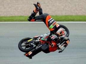 Finnish Niklas Ajo of TT Motion Events Racing team crashes during the second training session of the Moto3 of Germany at the Sachsenring Circuit on July 6, 2012 in Hohenstein-Ernstthal, eastern Germany.  RONNY HARTMANN/AFP/GettyImages