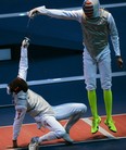 Egypt's Alaaeldin Abouelkassem (L) fences against US fencer Miles Chamley-Watson during their Men's foil bout as part of the  fencing event of London 2012 Olympic games, on July 31, 2012 at the ExCel centre in London.  AFP PHOTO / TOSHIFUMI KITAMURA