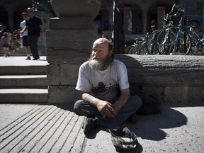 MONTREAL, QUE.: JULY 11, 2012-- Homeless Rejean Ouellette panhandles near the corner of Sherbrooke street and Union street in downtown Montreal on Wednesday, July 11, 2012. (Dario Ayala/THE GAZETTE)