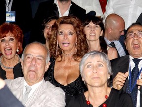 Maria Scicolone (left) and Sophia Loren at the 58th Taormina Film Fest on June 28, 2012 in Taormina, Italy.  They are watching the UEFA Euro 2012 Italy vs Germany soccer game even though the cutline that came with this photo did not say so. (Maurizio Lagana/Getty Images)