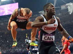 LONDON, UK: AUGUST 11, 2012, 2012  -  Justyn Warner(R) and Jared Connaughton of Canada celebrate what they thought was a bronze medal in the men's 4x100m final during the London 2012 Olympic Games, August 11, 2012.  They were later disqualified.  Photo by Jean Levac/Postmedia Olympic Team