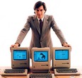 Stevfe Jobs shows off the first Macs, circa 1984