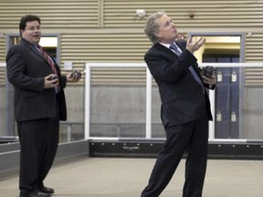 Jean Charest may have dropped the ball on this one. The Liberal leader, seen here with his former minister Tony Tomassi during the 2008 provincial election campaign, was likely unaware that Tomassi has a court date scheduled for Sept. 4. Credit: THE GAZETTE/ Vincenzo D'Alto