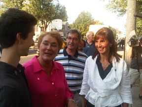 Pauline Marois, Scott McKay and Lizabel Nitoi speak to a voter in L'Assomption riding