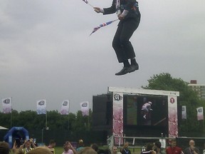 This mobile phone photo provided by Lee Medcalf shows Boris Johnson, the mayor of London, dangling in midair above the crowds at an open-air viewing site at east London's Victoria Park, on Wednesday, Aug. 1, 2012. (AP Photo/Lee Medcalf)