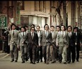 Guys in fancy suits doing the old slo-mo walk. . . is there such a thing as seeing that too often? Nah! These guys are doing their thing in the Korean film Nameless Gangster: Rules of the Time.