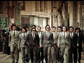 Guys in fancy suits doing the old slo-mo walk. . . is there such a thing as seeing that too often? Nah! These guys are doing their thing in the Korean film Nameless Gangster: Rules of the Time.