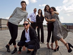 MONTREAL, QUE: AUGUST 16, 2012 - Model Alexandria with Denis Gagnon, left, Philippe Dubuc with model Pamela and model Romane with Sabrina Barila, right, during a catalogue photo shoot to publicize their collections for Simons' Icone line at the Simons studio in Montreal, on Thursday, August 16, 2012  (Dave Sidaway / THE GAZETTE)