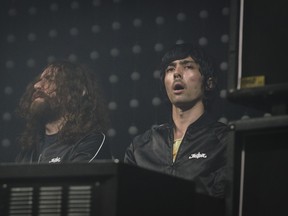 Gaspard Augé, left, and Xavier de Rosnay, right, of the French electronic duo, Justice perform during the first day of the Osheaga Music and Arts Festival (Tijana Martin/The Gazette)