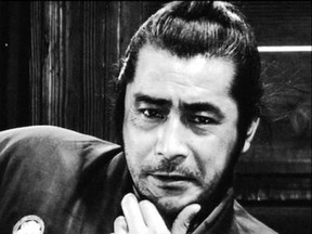 Toshiro Mifune thinks deeply in Akira Kurosawa's samurai film Yojimbo.