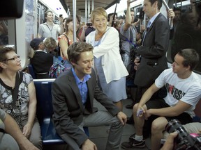 PQ leader Pauline Marois and candidate Leo Bureau-Blouin ride the metro in Montreal Thursday August 2, 2012.  (Vincenzo D'Alto / THE GAZETTE)