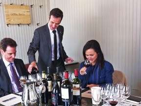 Pouring wine for the tasting at Communion (photo by Lesley Trites)