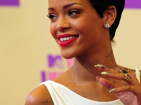 Rihanna poses on arrival on the red carpet for the MTV Video Music Awards in Los Angeles on September 6, 2012 in California.   AFP PHOTO / Frederic J. BROWNFREDERIC J. BROWN/AFP/GettyImages