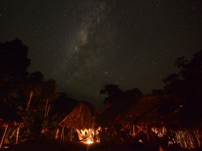 Night view of Irotatheri community, in Amazonas state, southern Venezuela, 19 km away from the border with Brazil, on September 7, 2012. The Venezuelan government on Friday agreed to lead a delegation of national and international media to Irotatheri after a slaughter of 80 Yanomami natives was reported. Venezuelan militarymen detected evidence of illegal mining in the south of the country, where Yanomami natives would have presumably been massacred by Brazilian illegal gold prospectors.  AFP PHOTO/Leo RAMIREZLEO RAMIREZ/AFP/GettyImages