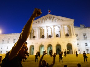 Protesters shout slogans during a demonstration in front of the parliament in Lisbon, on September 15, 2012. Last week, Portuguese Prime Minister Pedro Passos Coelho announced an increase in workers social security contributions from 11 to 18 per cent of their monthly salary and Portuguese Finance Minister Vitor Gaspar said income taxes will go up next year and public employees will lose either their Christmas or vacation bonus, roughly equivalent to a month's income. These measures come after the fifth Troika evaluation of the Portuguese bailout program. FRANCISCO LEONG/AFP/GettyImages