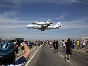 In this image released by NASA , the Space shuttle Endeavour, mounted atop a NASA 747 Shuttle Carrier Aircraft (SCA) lands at Los Angeles International Airport, on September 21, 2012. Endeavour, built as a replacement for space shuttle Challenger, completed 25 missions, spent 299 days in orbit, and orbited Earth 4,671 times while traveling 122,883,151 miles (197,761,261.76kms). Beginning October 30, the shuttle will be on display in the California Science center's Samuel Oschin Space Shuttle Endeavour  Display Pavilion, embarking on its new mission to commemorate past achievements in space and educate and inspire future generations of explorers. = RESTRICTED TO EDITORIAL USE - MANDATORY CREDIT "AFP PHOTO / NASA / Matt Hedges" - NO MARKETING NO ADVERTISING CAMPAIGNS - DISTRIBUTED AS A SERVICE TO CLIENTS =Matt Hedges/AFP/GettyImages