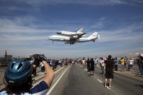 In this image released by NASA , the Space shuttle Endeavour, mounted atop a NASA 747 Shuttle Carrier Aircraft (SCA) lands at Los Angeles International Airport, on September 21, 2012. Endeavour, built as a replacement for space shuttle Challenger, completed 25 missions, spent 299 days in orbit, and orbited Earth 4,671 times while traveling 122,883,151 miles (197,761,261.76kms). Beginning October 30, the shuttle will be on display in the California Science center's Samuel Oschin Space Shuttle Endeavour  Display Pavilion, embarking on its new mission to commemorate past achievements in space and educate and inspire future generations of explorers. = RESTRICTED TO EDITORIAL USE - MANDATORY CREDIT "AFP PHOTO / NASA / Matt Hedges" - NO MARKETING NO ADVERTISING CAMPAIGNS - DISTRIBUTED AS A SERVICE TO CLIENTS =Matt Hedges/AFP/GettyImages