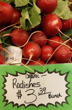 FILE - HOLD FOR RELEASE UNTIL 5:00 P.M. EDT AND THEREAFTER ON SEPT. 3, 2012 - This March 16, 2011, file photo shows organic radishes at the Pacifica Farmers Market in Pacifica, Calif. Patient after patient asked: Is eating organic food, which costs more, really better for me? Unsure, Stanford University doctors dug through reams of research to find out _ and concluded there's little evidence that going organic is much healthier, citing only a few differences involving pesticides and antibiotics. Eating organic fruits and vegetables can lower exposure to pesticides, including for children _ but the amount measured from conventionally grown produce was within safety limits, the researchers reported Monday, Sept. 3, 2012. (AP Photo, File)