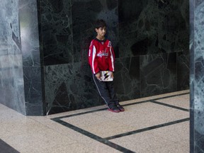 A young hockey fan waits in the lobby of the building housing the NHLPA offices in Toronto last month as negotiations continued over collective bargaining between the NHL and the NHLPA in an attempt to avoid a potential lockout. Given the state of those talks this week, he better be patient. THE CANADIAN PRESS/ Chris Young