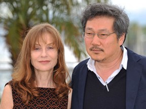 Actress Isabelle Huppert and South Korean director Hong Sang-soo at  photocall for In Another Country,  the 65th Annual Cannes Film Festival at Palais des Festivals on May 21, 2012 in Cannes, France.  The film will be shown at Montreal's Festival du Nouveau Cinema 2012. (Gareth Cattermole/Getty Images)