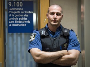 A Quebec special constable watches the entrance as former FBI agent Joe Pistone, also known as Donnie Brasco, testified from behind a screen on Monday at the Charbonneau inquiry looking into corruption in the Quebec construction industry. Security has been tight at the inquiry and will remain so for the duration. THE CANADIAN PRESS/Ryan Remiorz