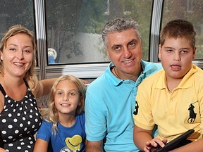 MONTREAL, QUE.: SEPTEMBER 8, 2012--Paolo Divito, second from right, is the founder of a foundation that is opening a respite home in Pierrefonds for families with kids with Angelman Syndrome. Mr Divito is photographed at home with his wife Sophie, left, their 7 yrs old daughter, Olivia and their 11 yrs old son Luca, right who has the syndrome. (Marie-France Coallier/The Gazette)