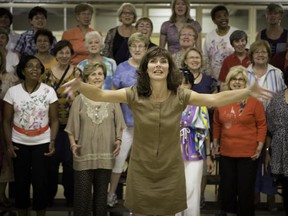 Director Tracey Larder, foreground, leads the all-female West Island Chorus, a chapter of Sweet Adelines International, at Ste-Geneviève United Church.