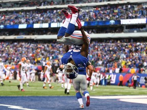 EAST RUTHERFORD, NJ - OCTOBER 07:  David Wilson #22 of the New York Giants celebrates his touchdown against the Cleveland Browns by doing a backflip during their game at MetLife Stadium on October 7, 2012 in East Rutherford, New Jersey.  (Photo by Al Bello/Getty Images)