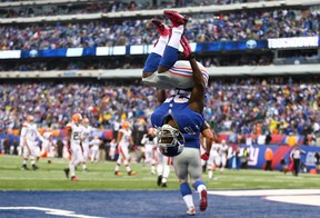 EAST RUTHERFORD, NJ - OCTOBER 07:  David Wilson #22 of the New York Giants celebrates his touchdown against the Cleveland Browns by doing a backflip during their game at MetLife Stadium on October 7, 2012 in East Rutherford, New Jersey.  (Photo by Al Bello/Getty Images)