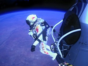 Pilot Felix Baumgartner of Austria jumps out of the capsule during the final manned flight for Red Bull Stratos on October 14, 2012 in space. Baumgartner broke the world record for the highest free fall in history after making a 23-mile ascent in capsule attached to a massive balloon.  (Photo by Jay Nemeth/Red Bull Stratos via Getty Images)